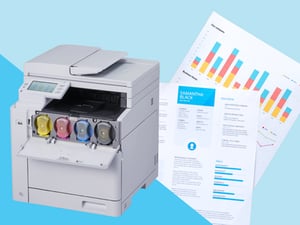 OKI A4 colour multifunction printer with its toner cartridges on show, beside printed colour reports